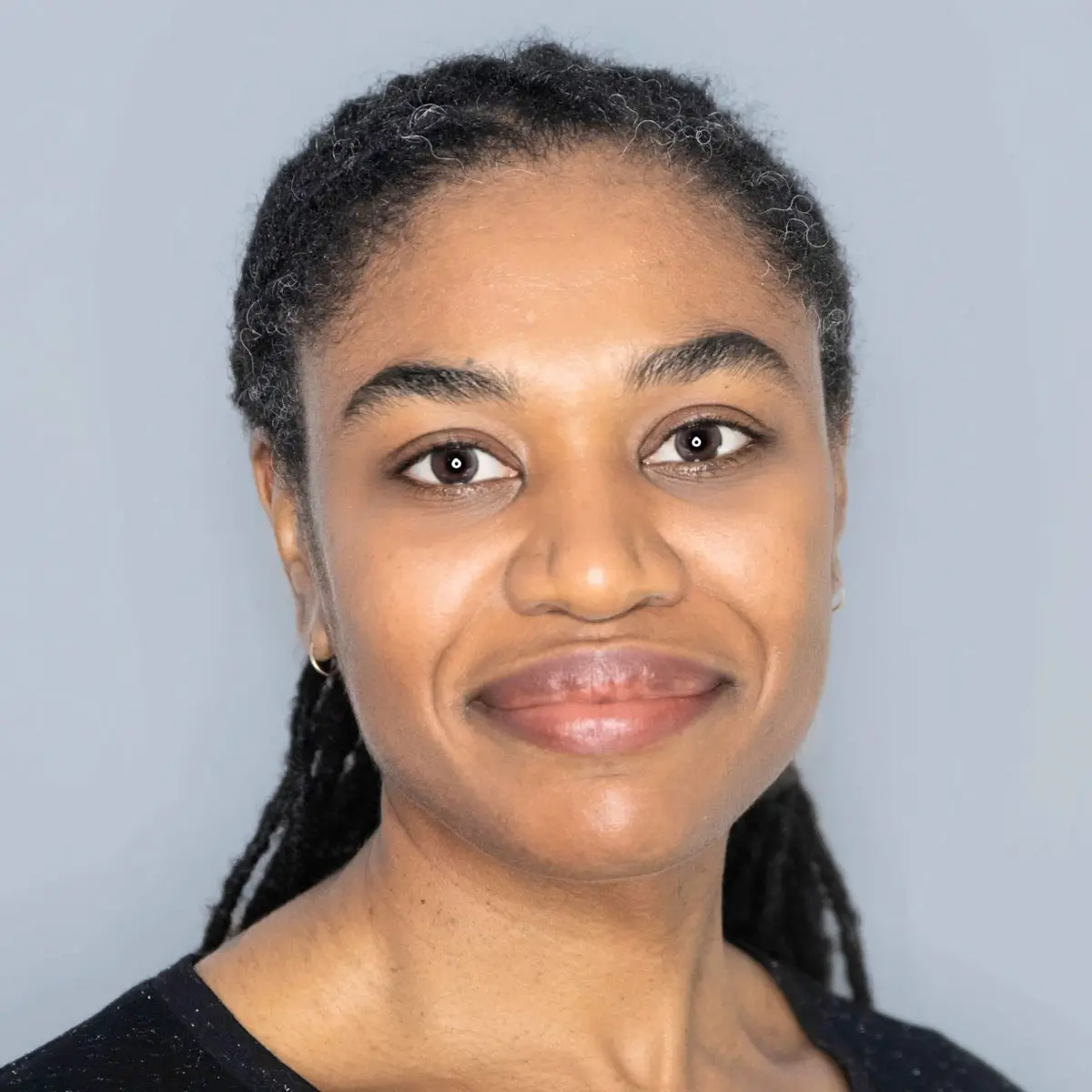 Natacha Kerelejza professional headshot with braided hair | Licensed Therapist & Counseling Team | Covington, LA (70433)