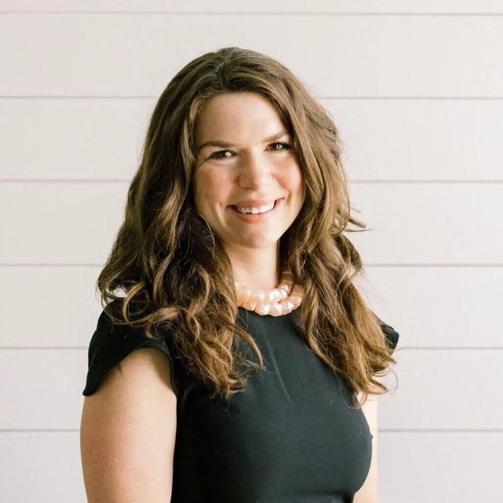 Sarah Cairns smiling in black top with pink necklace | Professional Therapist Headshot | Covington, LA (70433)